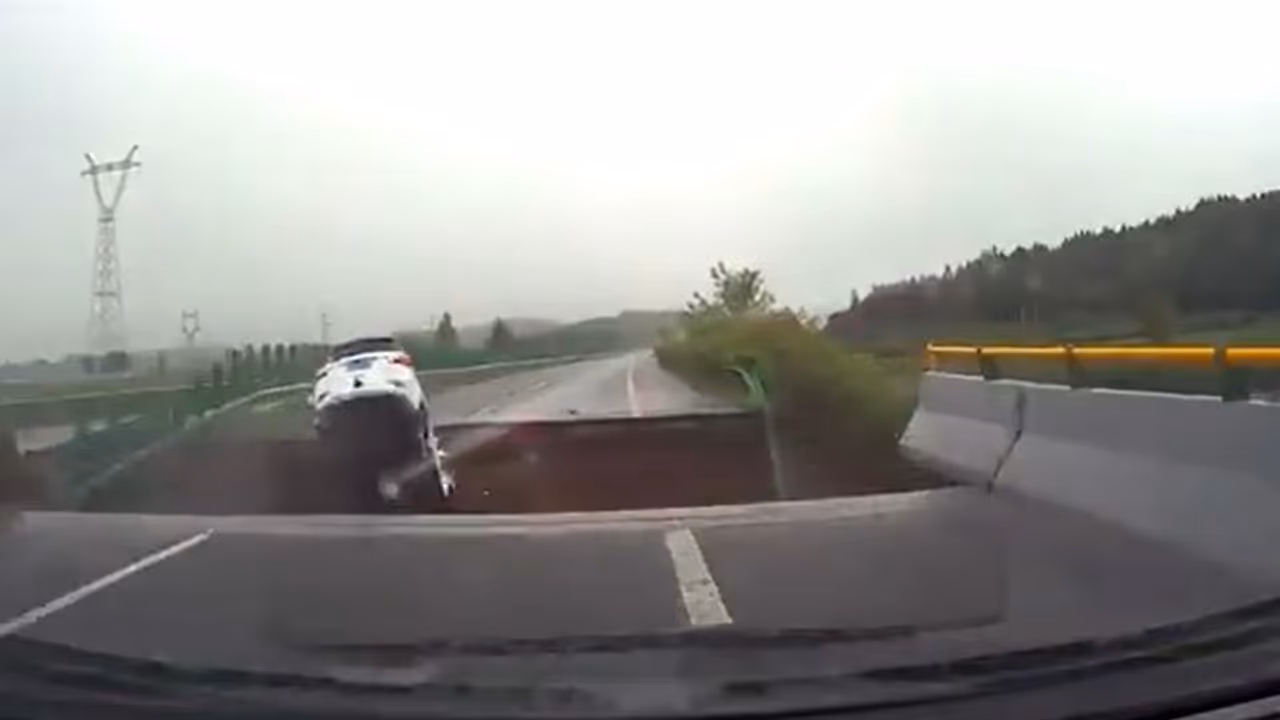 WATCH: Terrifying video shows car plunging into massive crater in China as Typhoon Doksuri destroys roads WATCH: Terrifying video shows car plunging into massive crater in China as Typhoon Doksuri destroys roads
