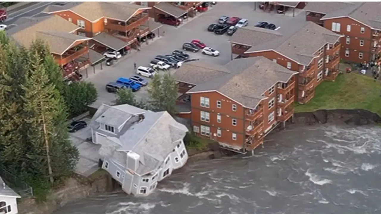 Cascade of destruction: Two storey house collapses into Alaska river amid record glacial flooding WATCH Cascade of destruction: Two storey house collapses into Alaska river amid record glacial flooding WATCH