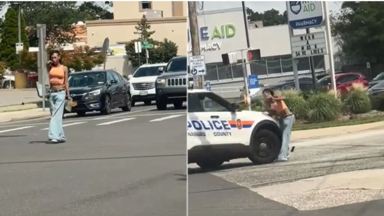 WATCH: US woman pointing gun at traffic struck by police car; disturbing video goes viral WATCH: US woman pointing gun at traffic struck by police car; disturbing video goes viral