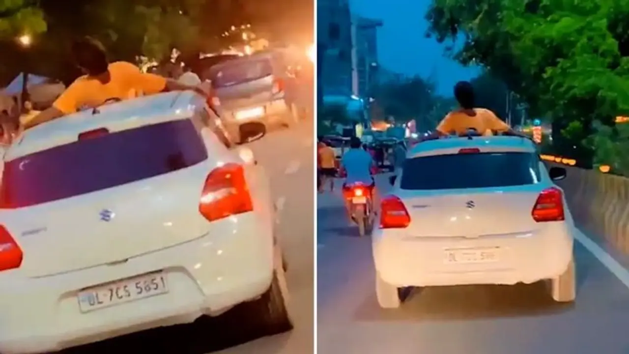 Noida man performs stunt on car roof, owner fined Rs 26,000 | WATCH