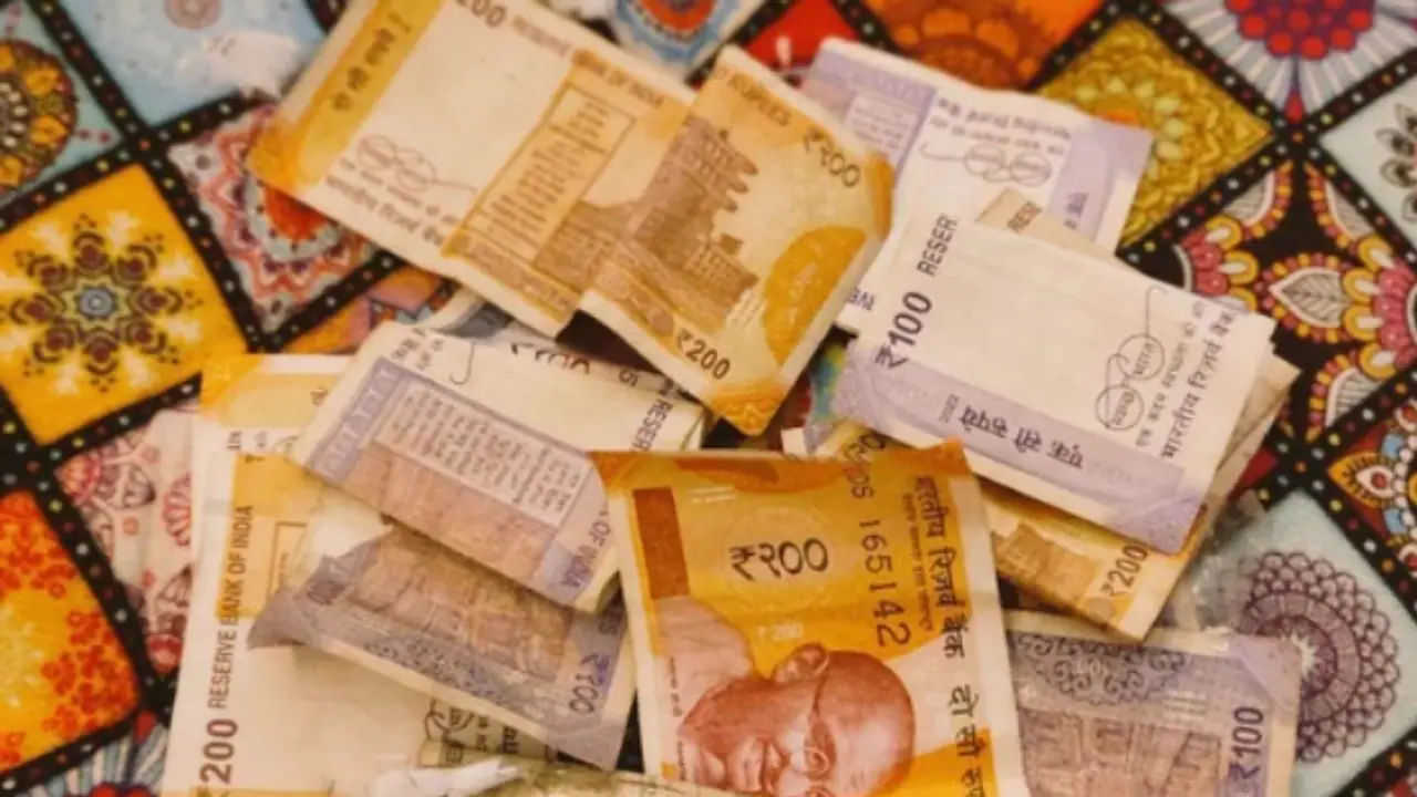 Bureaucrat Shares Pic Of Money Kept By Students In Answer Sheets