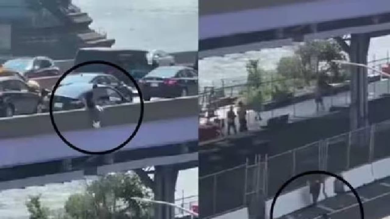 കാറിൽ നിന്നും പുറത്തേക്കിറങ്ങി താഴേക്ക് ചാടി യുവാവ്, ഡ്രൈവറെ കൊള്ളയടിച്ച ശേഷമെന്ന് കാപ്ഷൻ; വൈറലായി വീഡിയോ കാറിൽ നിന്നും പുറത്തേക്കിറങ്ങി താഴേക്ക് ചാടി യുവാവ്, ഡ്രൈവറെ കൊള്ളയടിച്ച ശേഷമെന്ന് കാപ്ഷൻ; വൈറലായി വീഡിയോ