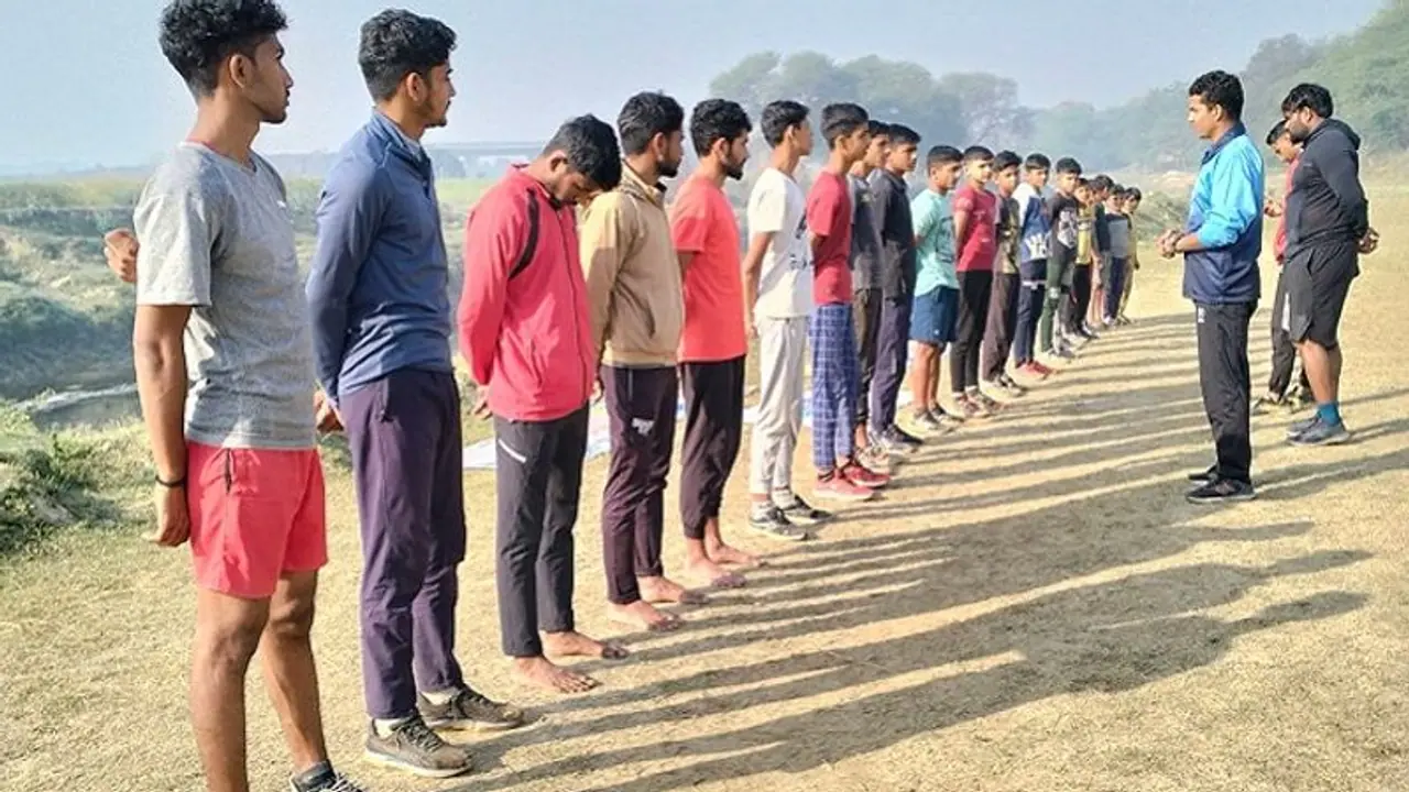 Not in stadiums, but these players train near the river banks in this village