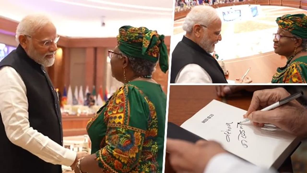 WATCH: WTO's Director General Ngozi Okonjo Iweala asks PM Modi for an autograph on his book Modi@20 WATCH: WTO's Director General Ngozi Okonjo Iweala asks PM Modi for an autograph on his book Modi@20