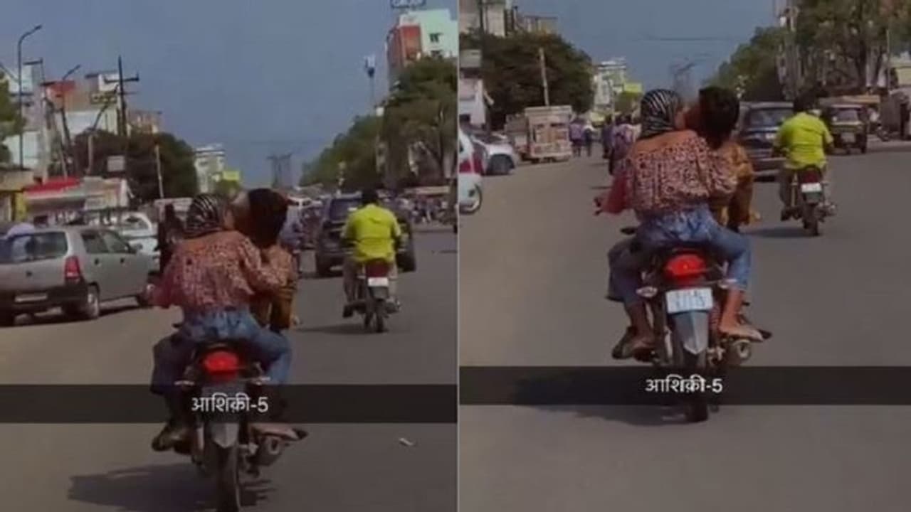 కదులుతున్న బైక్‌పై ముద్దులు పెట్టుకుంటూ జంట రొమాన్స్.. వీడియో వైరల్.. 