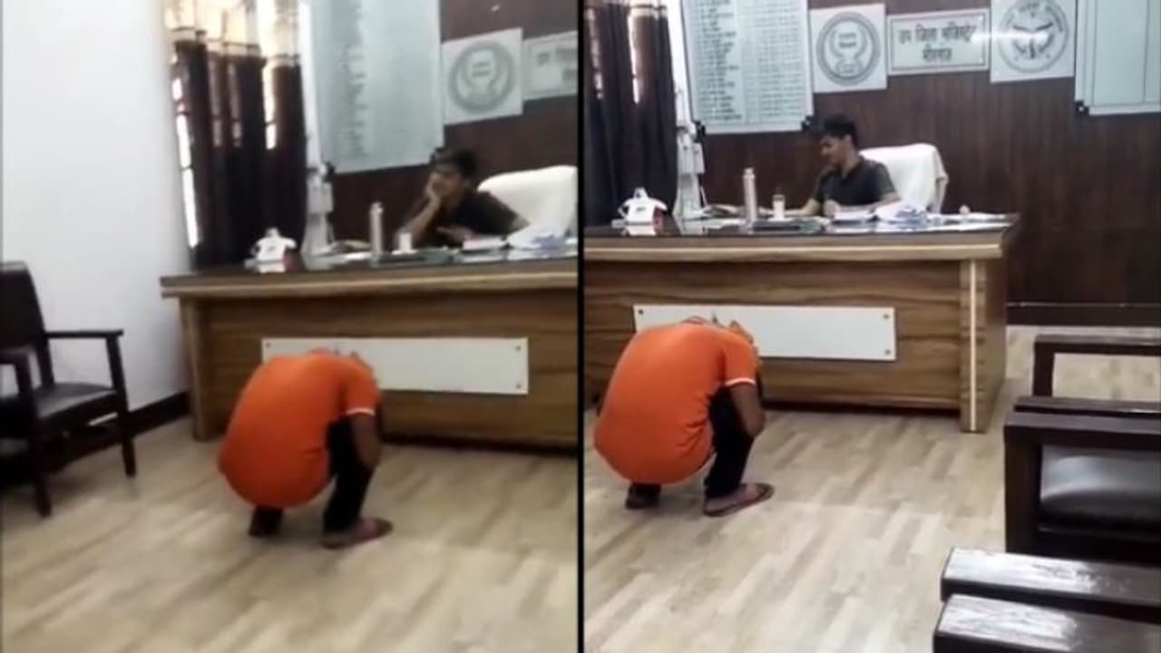 കയ്യേറ്റത്തെ കുറിച്ച് പരാതി പറയാനെത്തിയ ആളെ കോഴിയെപ്പോലെ കുനിച്ചിരുത്തി; വീഡിയോ പുറത്ത്, ഉദ്യോഗസ്ഥനെതിരെ നടപടി