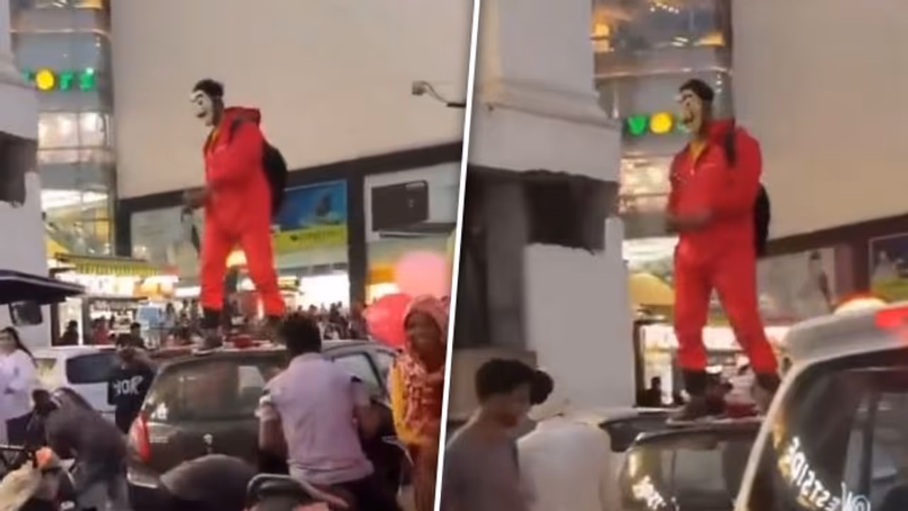 Viral video: Jaipur man dressed in 'Money Heist' costume showers money in air Viral video: Jaipur man dressed in 'Money Heist' costume showers money in air