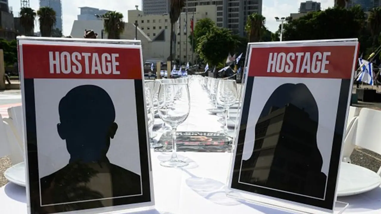 Over 200 empty chairs: Israelis set up symbolic Shabbat Dinner tables for hostages held by Hamas (WATCH) Over 200 empty chairs: Israelis set up symbolic Shabbat Dinner tables for hostages held by Hamas (WATCH)