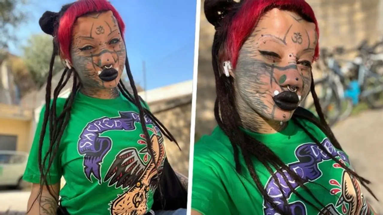 Shocking! 22 year old Italian woman gets 20 body modifications to transition into a cat; plans for more