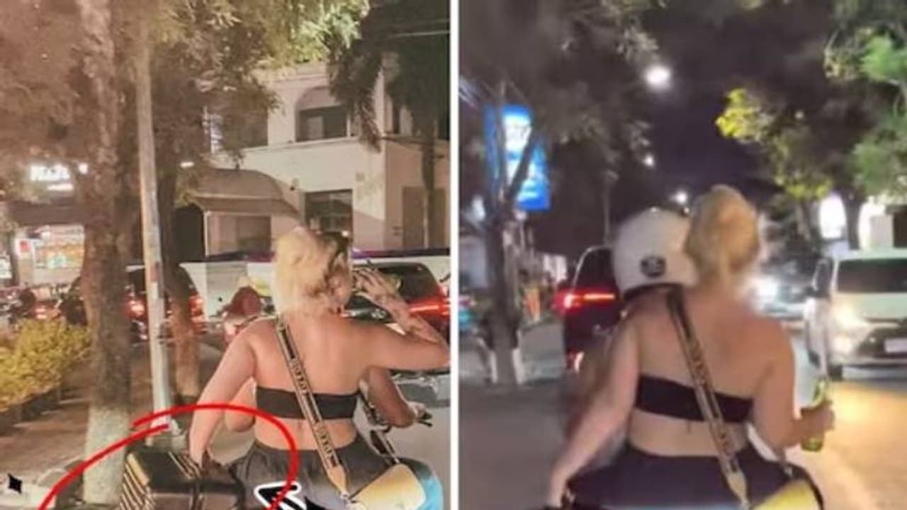 ഒരു കയ്യിൽ ല​ഗേജ്, മറുകയ്യിൽ ബിയർ, സ്കൂട്ടറിൽ പോകുന്ന യുവതി, വിമർശിച്ചും പിന്തുണച്ചും സോഷ്യൽമീഡിയ