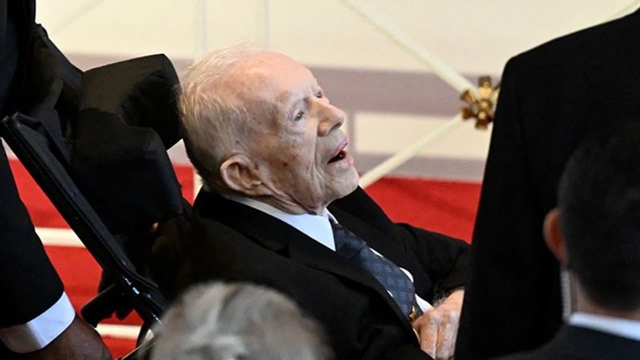 Former US President Jimmy Carter makes rare appearance at wife Rosalynn's memorial