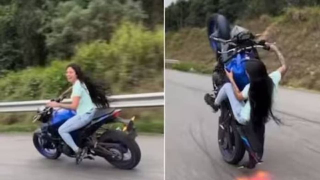 ഹെൽമറ്റ് പോലുമില്ല, നടുറോഡിൽ ബൈക്കിൽ യുവതിയുടെ അഭ്യാസപ്രകടനം, തലയിൽ കൈവച്ച് കാഴ്ച്ചക്കാർ ഹെൽമറ്റ് പോലുമില്ല, നടുറോഡിൽ ബൈക്കിൽ യുവതിയുടെ അഭ്യാസപ്രകടനം, തലയിൽ കൈവച്ച് കാഴ്ച്ചക്കാർ