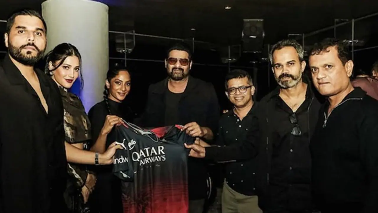 Prabhas and Salaar team receive special gift from RCB Viral picture takes social media by storm Prabhas and Salaar team receive special gift from RCB Viral picture takes social media by storm