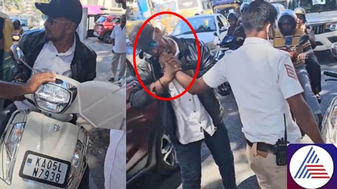 Bengaluru motorist bites traffic police's hand during heated altercation (WATCH) Bengaluru motorist bites traffic police's hand during heated altercation (WATCH)