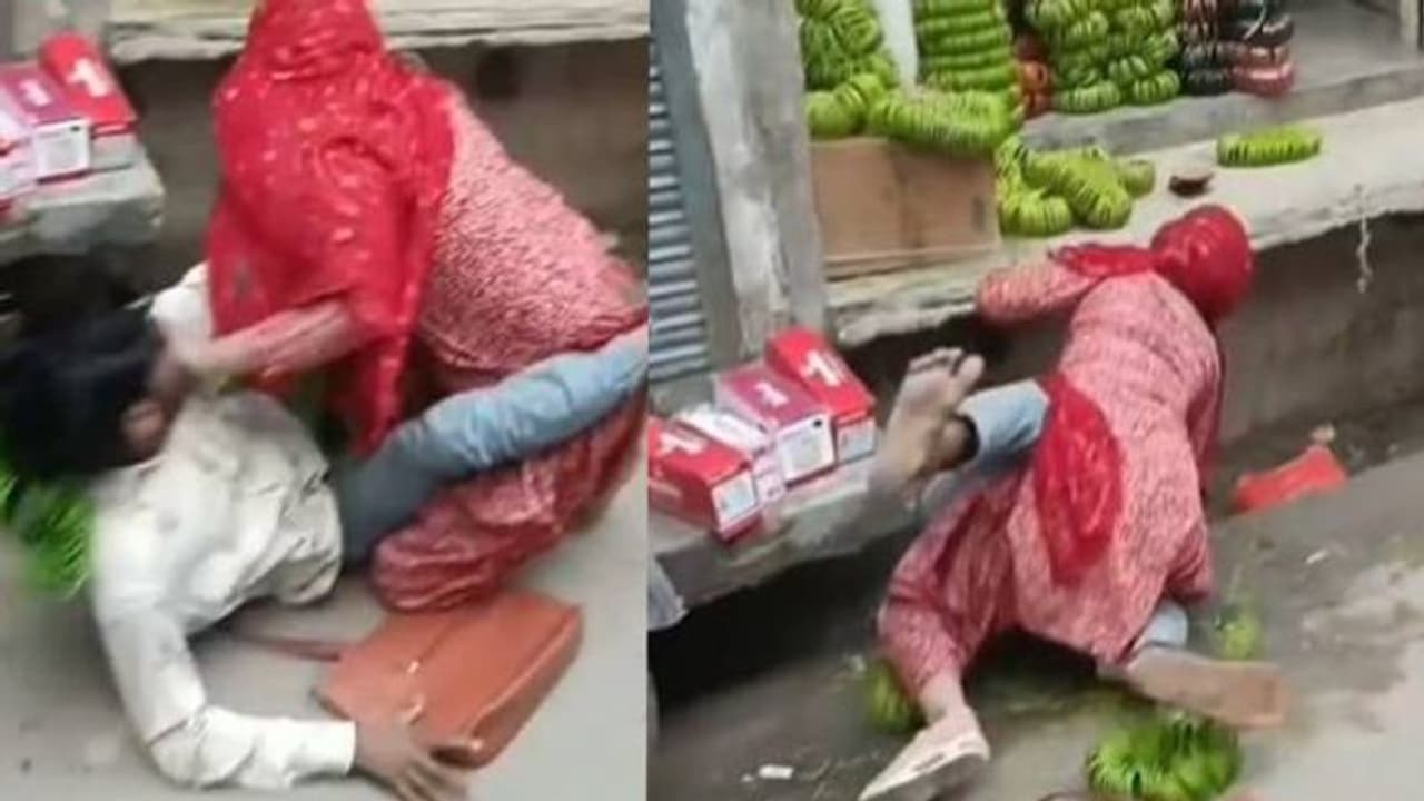 ഇതെന്ത് പുകില്? തെരുവിൽ യുവാവിനെ എടുത്തിട്ടടിച്ച് യുവതി, ആർത്തുവിളിച്ചും കയ്യടിച്ചും കാഴ്ചക്കാർ