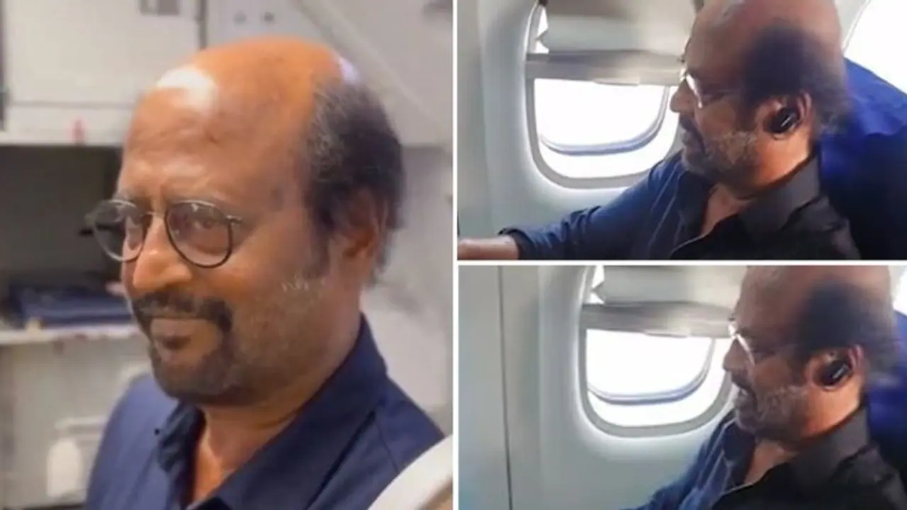 Rajinikanth travels in economy class, enjoys window seat; fans can't keep calm (Video) Rajinikanth travels in economy class, enjoys window seat; fans can't keep calm (Video)
