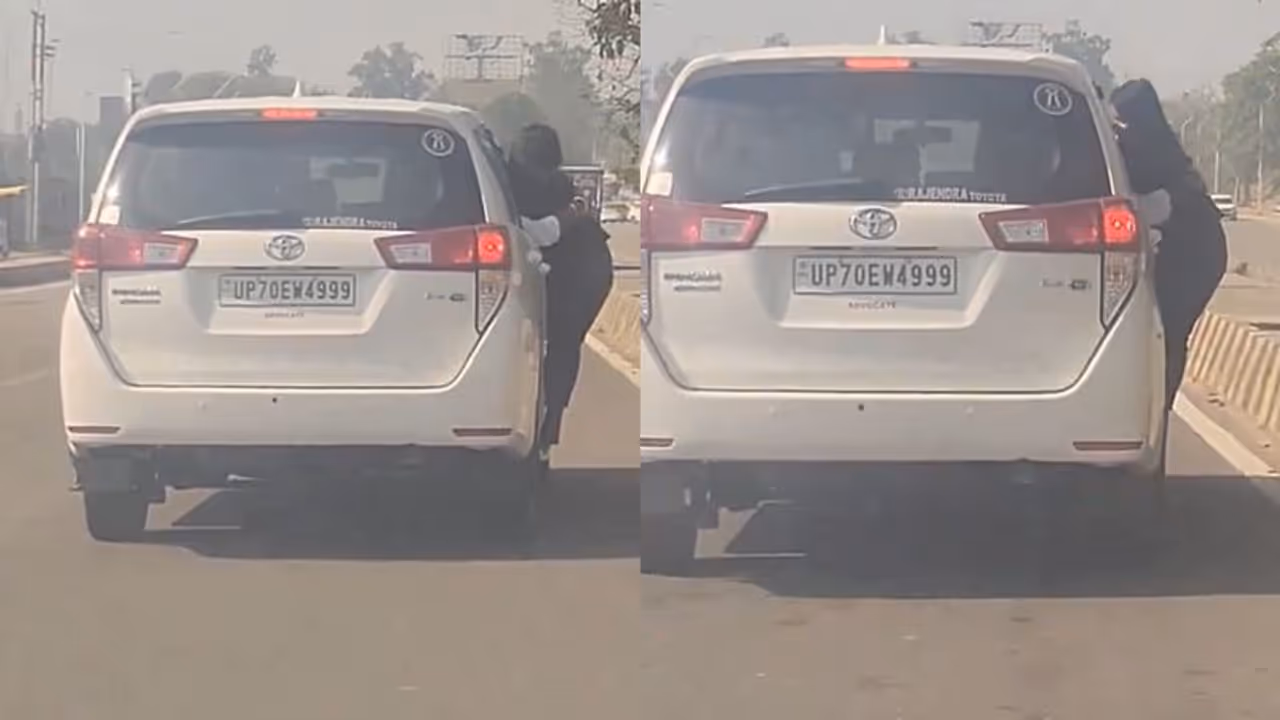 Viral Video: woman clinging to a moving car door in UP