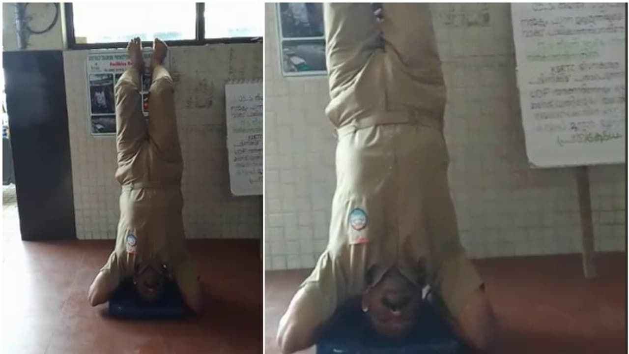 Kerala: KSRTC driver stage protest by standing upside down due to delay in salary Kerala: KSRTC driver stage protest by standing upside down due to delay in salary