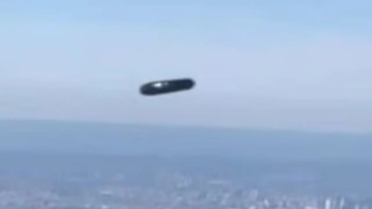 UFO spotted over New York City? Mysterious 'flying cylinder' gliding high in skies sparks speculation (WATCH) UFO spotted over New York City? Mysterious 'flying cylinder' gliding high in skies sparks speculation (WATCH)