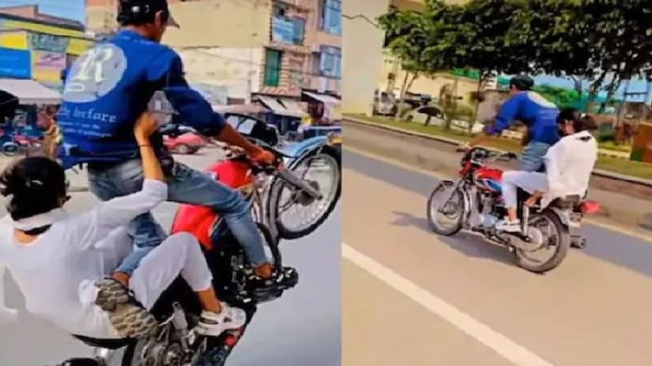 ഹെൽമെറ്റ് പോലുമില്ല, നടുറോഡിൽ ബൈക്കിൽ യുവതീയുവാക്കളുടെ അഭ്യാസപ്രകടനം; ഞെട്ടിക്കുന്ന വീഡിയോ വൈറൽ ഹെൽമെറ്റ് പോലുമില്ല, നടുറോഡിൽ ബൈക്കിൽ യുവതീയുവാക്കളുടെ അഭ്യാസപ്രകടനം; ഞെട്ടിക്കുന്ന വീഡിയോ വൈറൽ