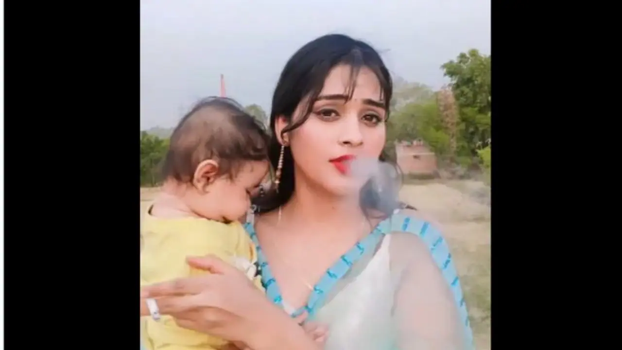 Viral Video: Outrage Mounts Over Video of Woman Smoking While Holding Toddler [watch]