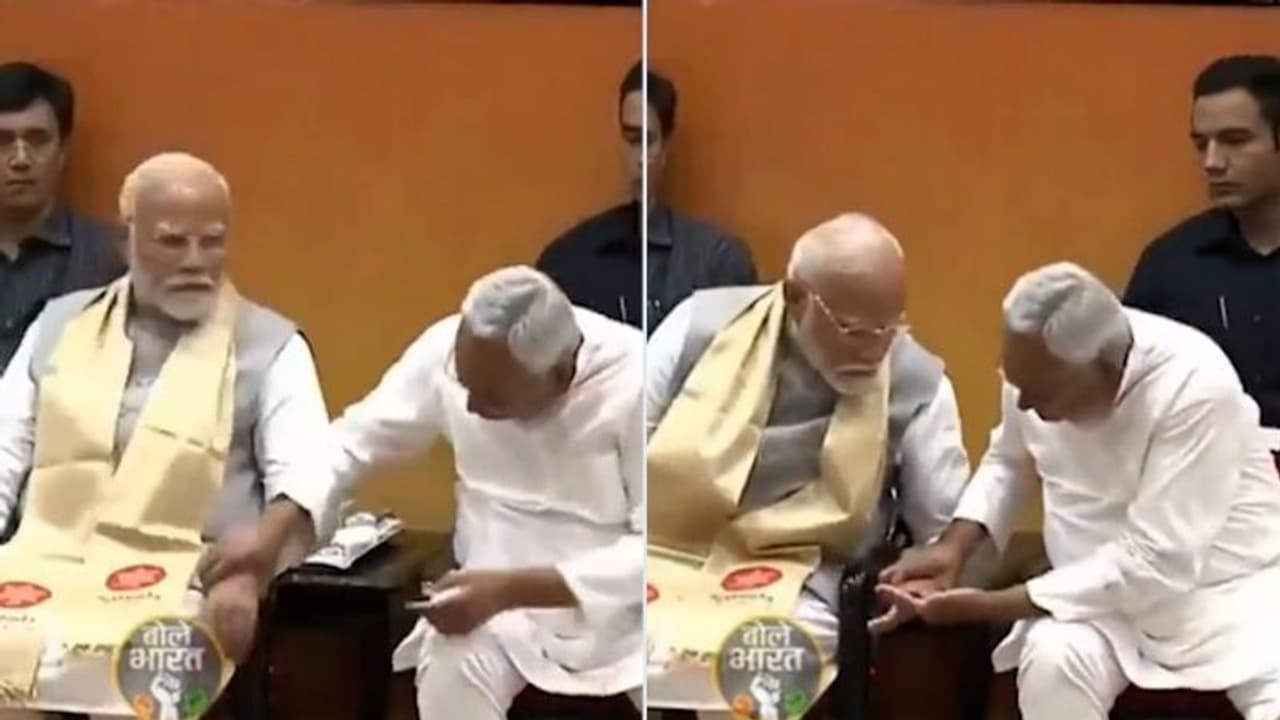 What is Nitish Kumar checking? Internet abuzz as Bihar CM checks PM Modi's hand in surprise move (WATCH) What is Nitish Kumar checking? Internet abuzz as Bihar CM checks PM Modi's hand in surprise move (WATCH)