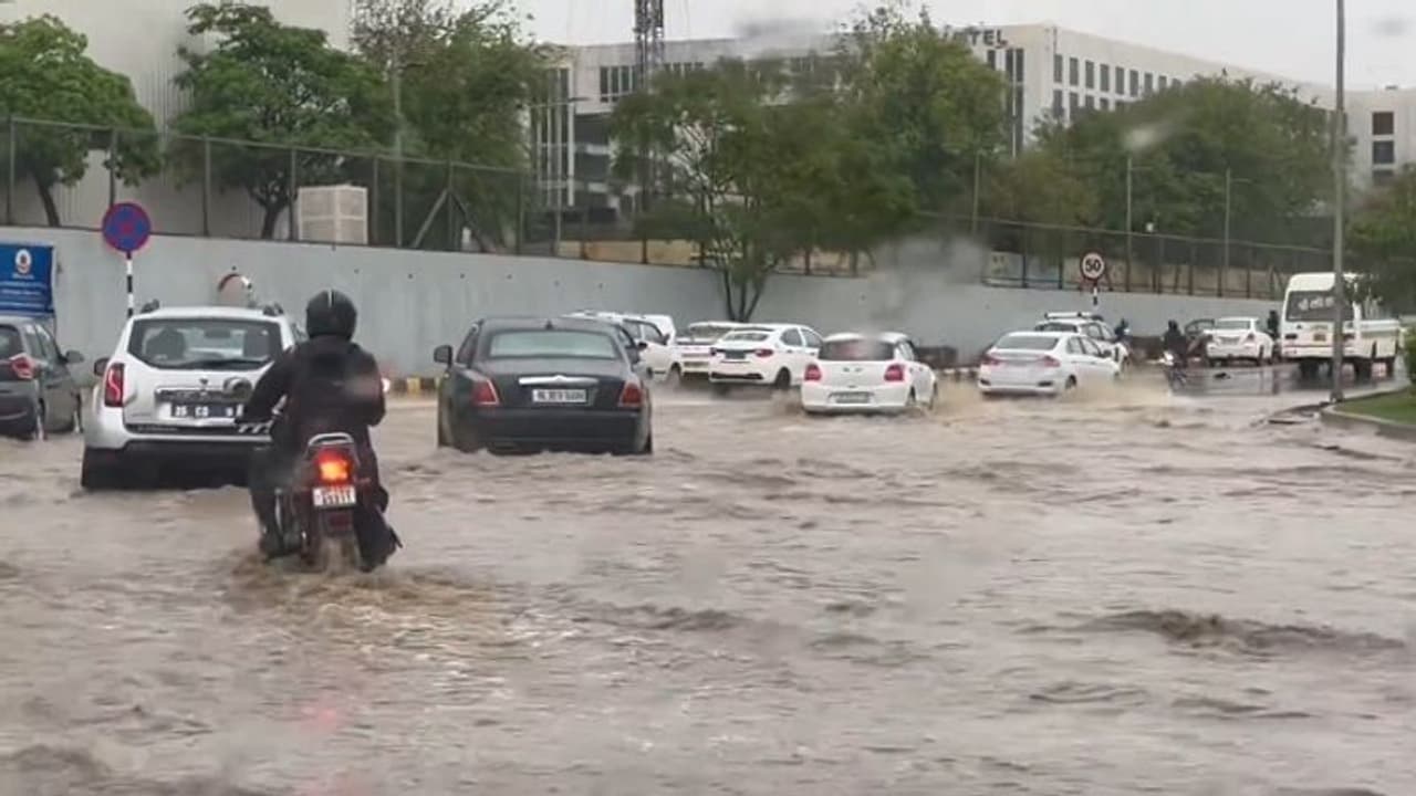 Delhi NCR drenched: Heavy rains flood roads, submerge cars, and slow traffic (WATCH)