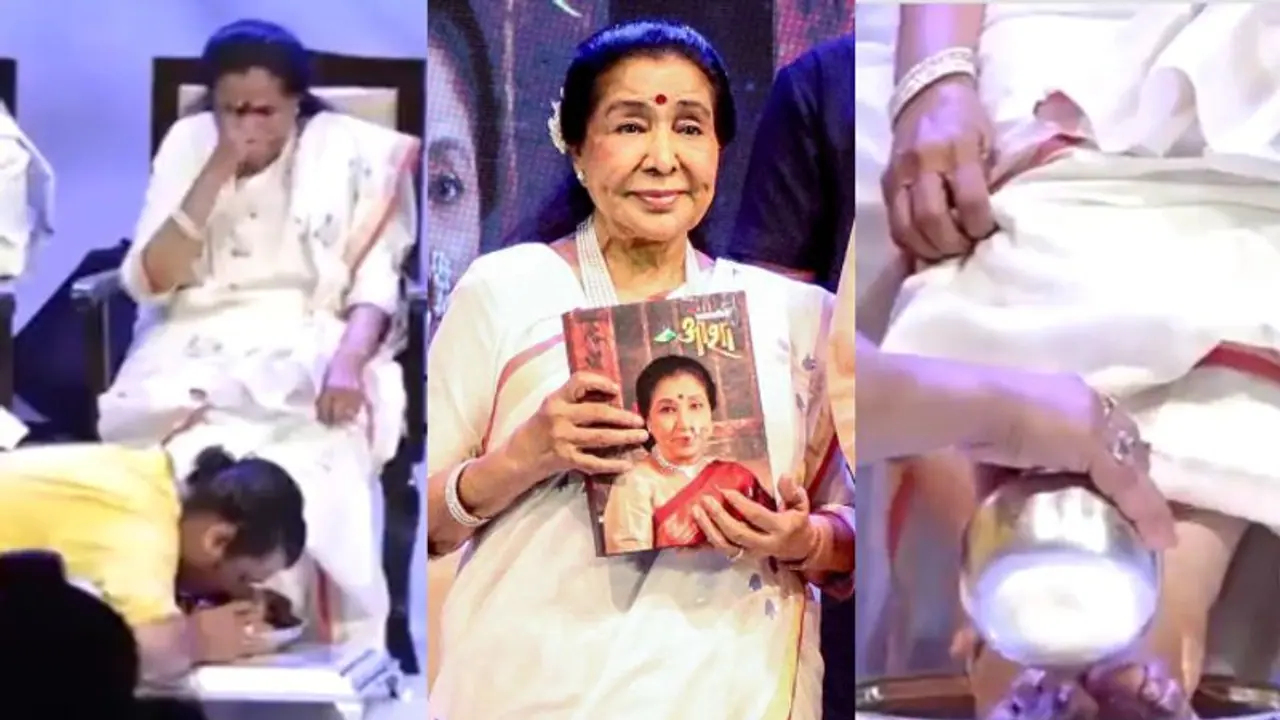 WATCH VIDEO: Asha Bhosle launches her biography 'Swarswamini Asha', Sonu Nigam washes and kisses her feet WATCH VIDEO: Asha Bhosle launches her biography 'Swarswamini Asha', Sonu Nigam washes and kisses her feet