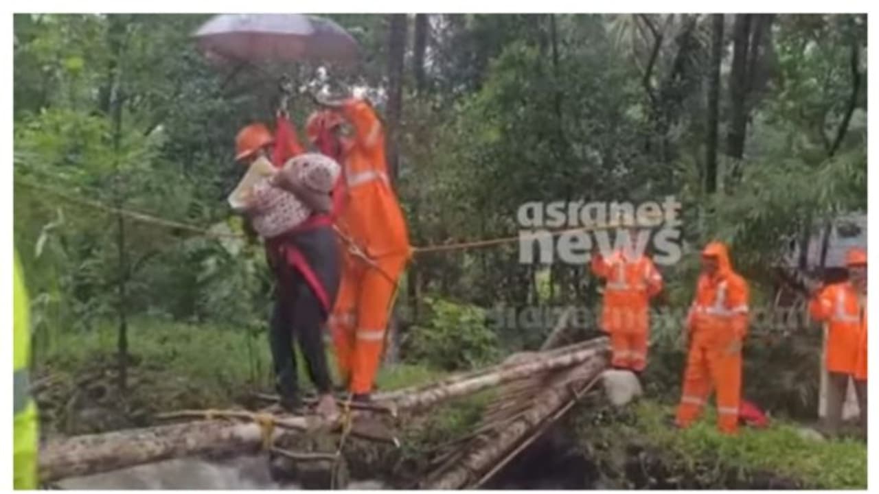 മഴയിൽ പാലം തകർന്നു, തുരുത്തിൽ ഒറ്റപ്പെട്ട് കുടുംബം, ഒന്നരമാസം പ്രായമുള്ള കുഞ്ഞും; രക്ഷകരായി ഫയർഫോഴ്സ് മഴയിൽ പാലം തകർന്നു, തുരുത്തിൽ ഒറ്റപ്പെട്ട് കുടുംബം, ഒന്നരമാസം പ്രായമുള്ള കുഞ്ഞും; രക്ഷകരായി ഫയർഫോഴ്സ്
