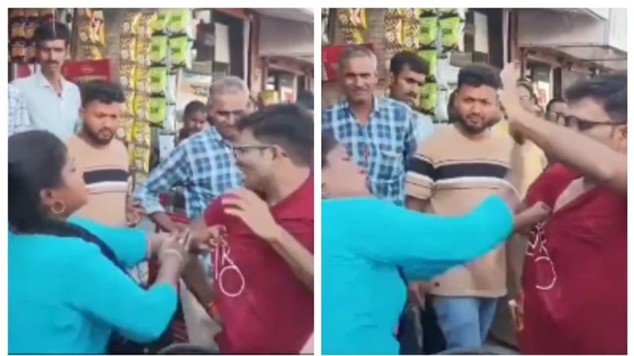 നടുറോഡിൽ ഭർത്താവിന്റെ കോളറിന് കുത്തിപ്പിടിച്ച് ഭാര്യയുടെ ചെകിട്ടത്തടി; വീഡിയോ എടുക്കാൻ നിർദ്ദേശവും നടുറോഡിൽ ഭർത്താവിന്റെ കോളറിന് കുത്തിപ്പിടിച്ച് ഭാര്യയുടെ ചെകിട്ടത്തടി; വീഡിയോ എടുക്കാൻ നിർദ്ദേശവും