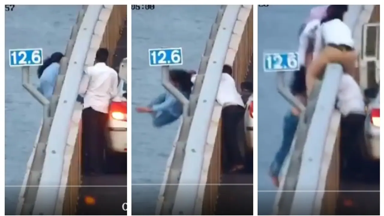 Woman 'loses balance' on Atal Setu barrier, rescued by quick thinking driver, police (WATCH) Woman 'loses balance' on Atal Setu barrier, rescued by quick thinking driver, police (WATCH)