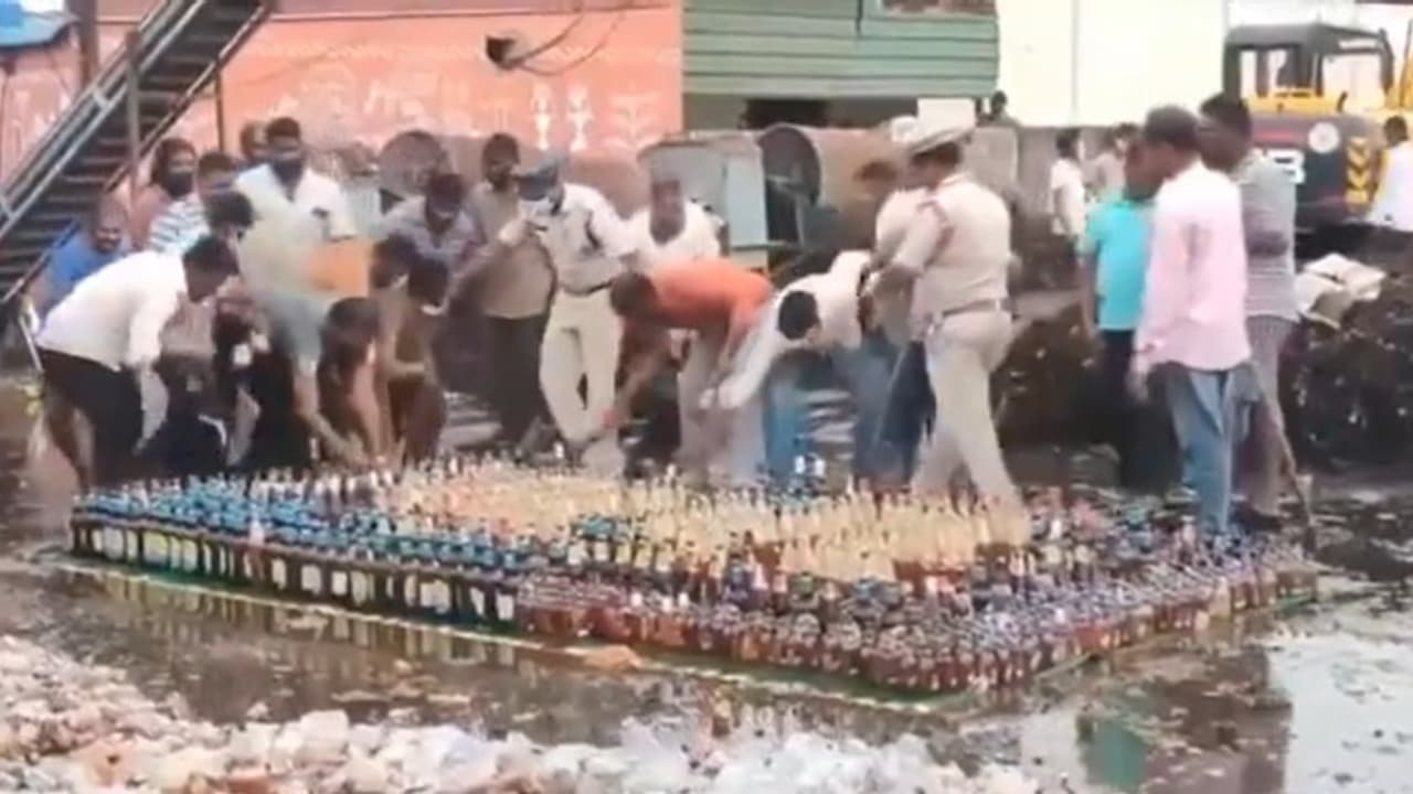 AP: Rs 50 lakh worth confiscated liquor sparks Guntur frenzy; locals seize bottles before destruction (WATCH)