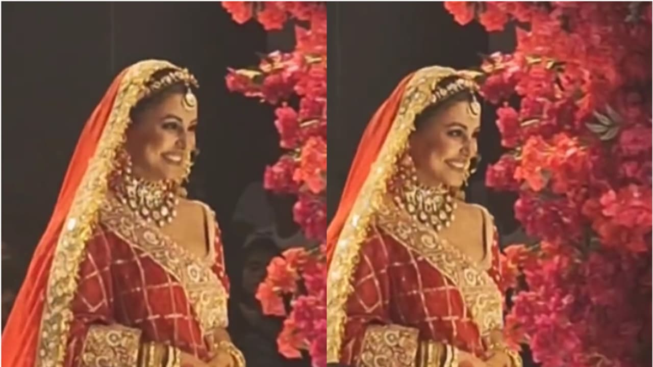 Hina Khan walks on the ramp amid breast cancer treatment; stuns in a red bridal look WATCH Hina Khan walks on the ramp amid breast cancer treatment; stuns in a red bridal look WATCH
