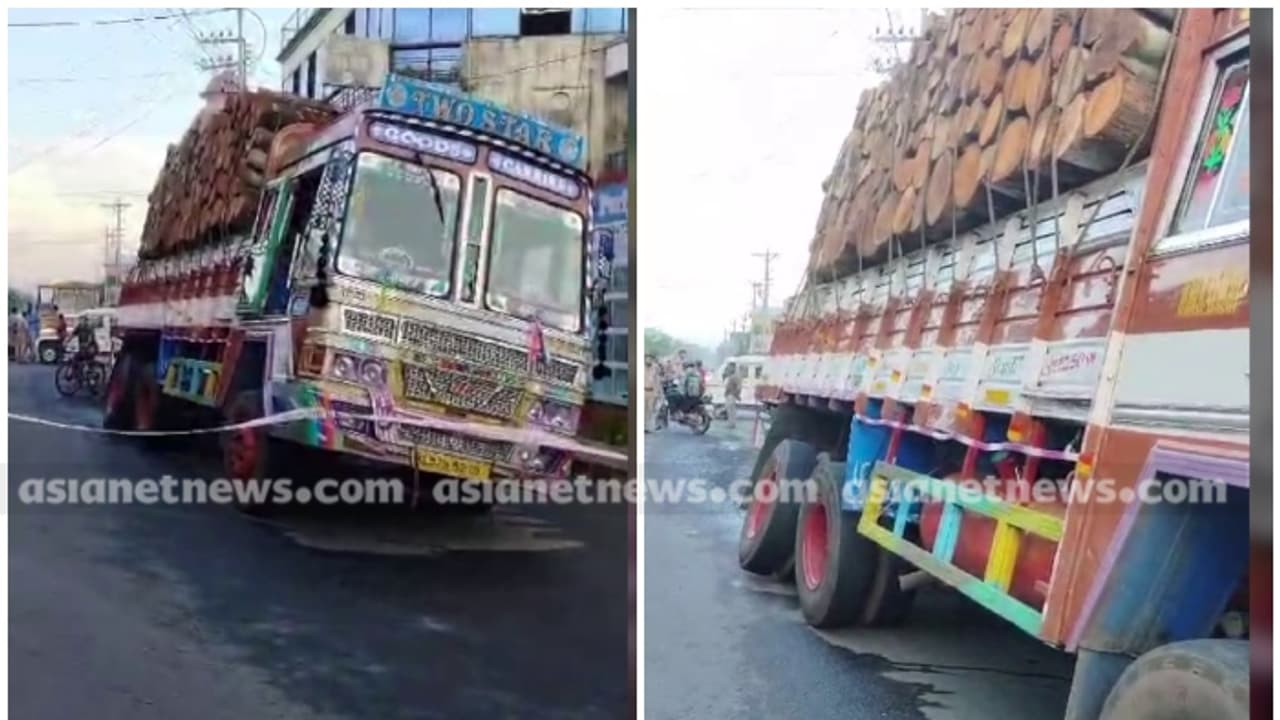 തടിയുമായി വന്ന ലോറി ഒരു വശത്തേക്ക് ചെരിഞ്ഞു, ടയർ ഊരിത്തെറിച്ച് സമീപത്തെ എടിഎം സെന്ററിന്റെ വാതിൽ തകർന്നു 