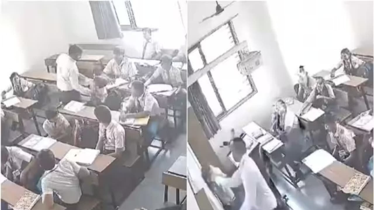 Gujarat SHOCKER! Teacher drags student by hair, bangs his head against wall & brutally thrashes him (WATCH) Gujarat SHOCKER! Teacher drags student by hair, bangs his head against wall & brutally thrashes him (WATCH)