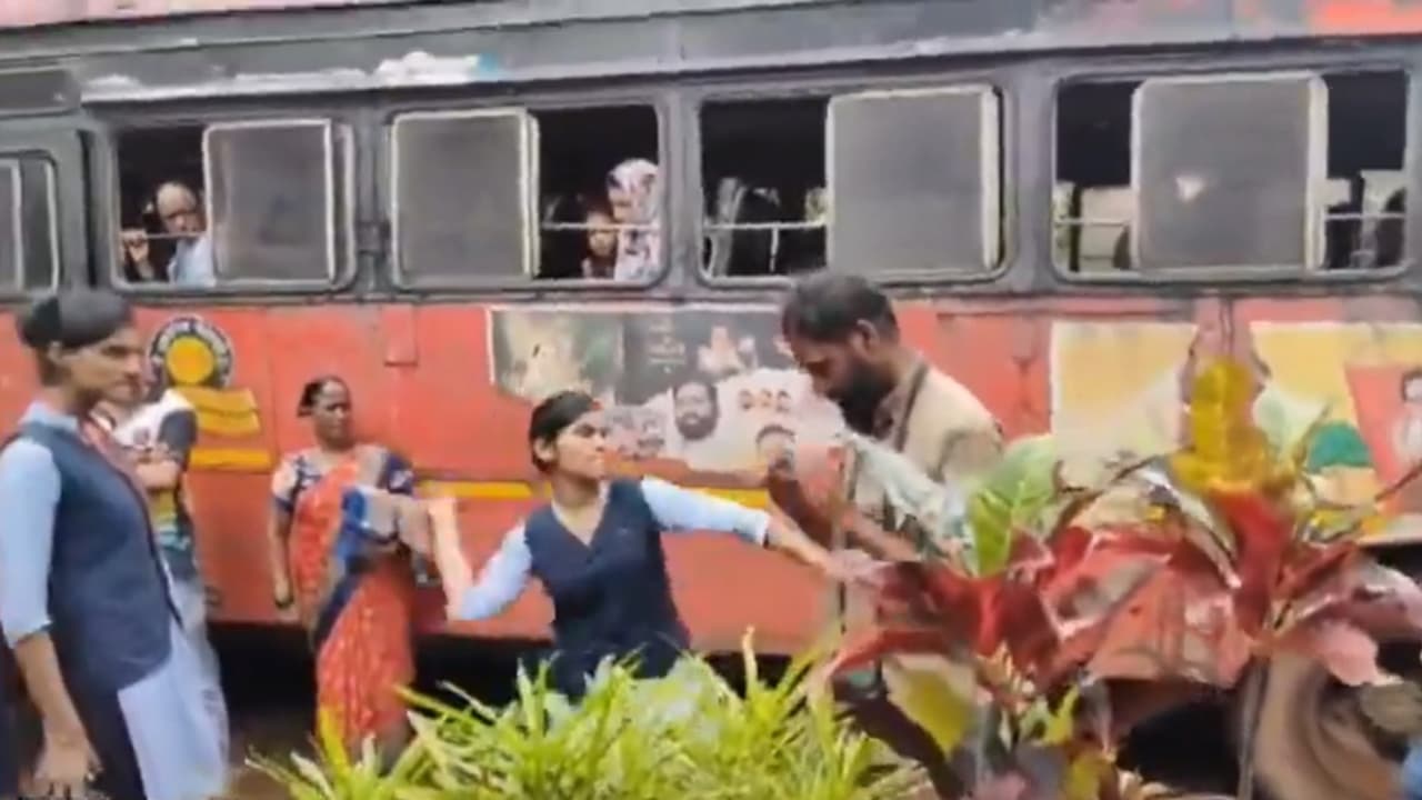 Maharashtra college student thrashes conductor with slippers in public for harassing girls inside bus (WATCH) Maharashtra college student thrashes conductor with slippers in public for harassing girls inside bus (WATCH)