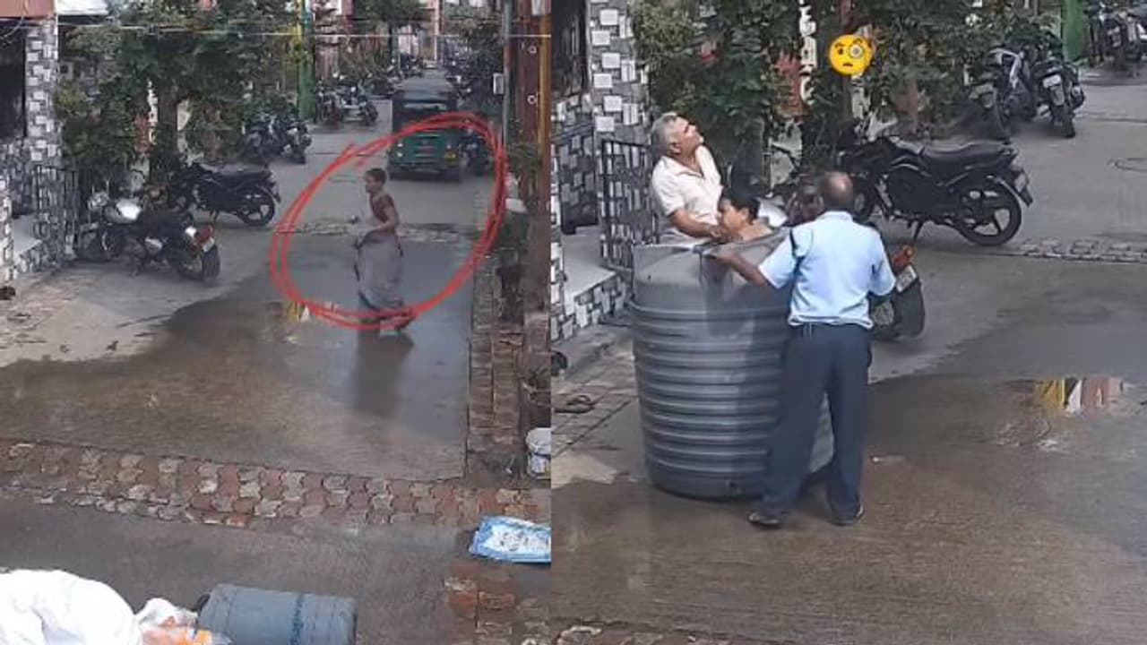 റോഡ് മുറിച്ച് കടക്കുന്ന സ്ത്രീ, തലയിലേക്ക് വന്നുവീണത് വാട്ടർ ടാങ്ക്, അത്ഭുതകരമായി രക്ഷപ്പെട്ടു