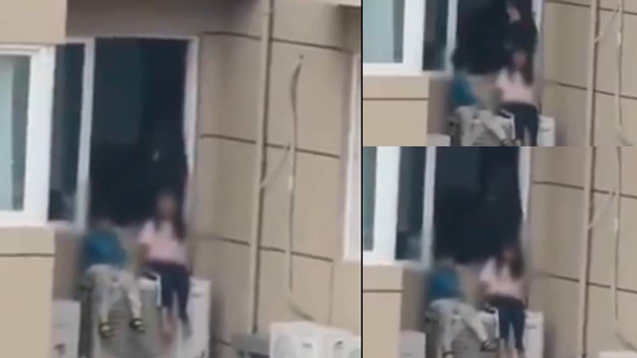 Woman in China puts kids out of 23rd floor window to frustrate husband; SHOCKING video goes viral (WATCH) Woman in China puts kids out of 23rd floor window to frustrate husband; SHOCKING video goes viral (WATCH)
