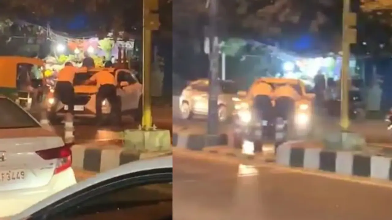 Delhi: Two traffic cops cling to car bonnet as driver takes U turn, speeds away; SHOCKING video emerges| WATCH