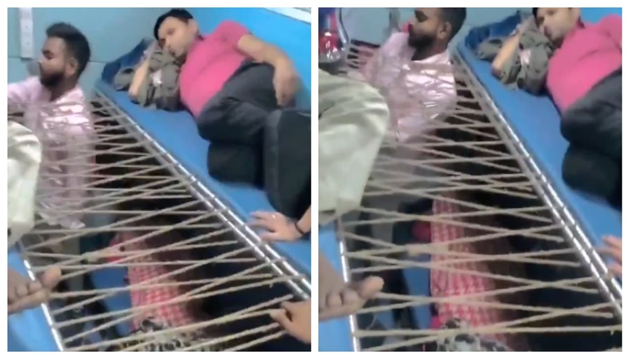 'വാട്ട് എൻ ഐഡിയ സർ ജി'; ട്രെയിനിലെ രണ്ട് ബര്‍ത്തുകൾക്കിടയിൽ സ്വന്തമായി സീറ്റുണ്ടാക്കി യാത്രക്കാരൻ; വീഡിയോ വൈറൽ