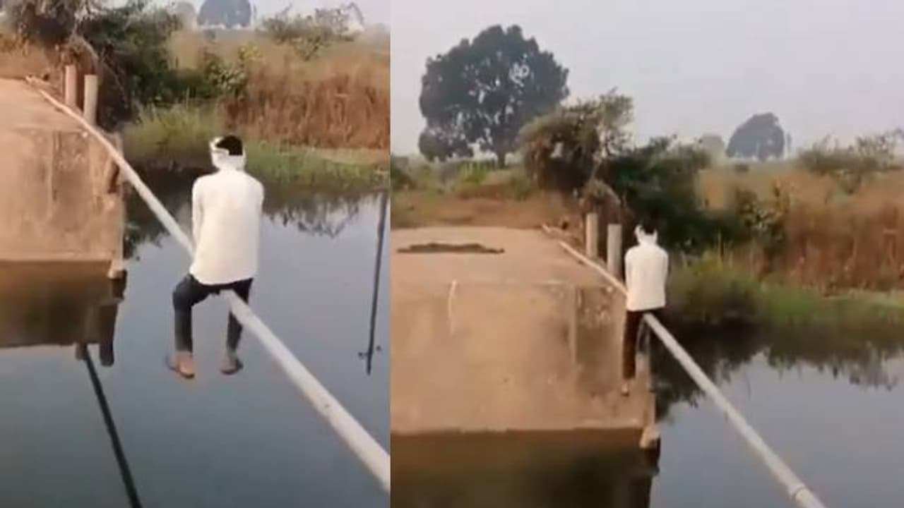 പാലമില്ല, ഇരുമ്പുപൈപ്പിലിരുന്ന് പുഴ കടക്കുന്ന ​മനുഷ്യൻ, തെലങ്കാനയിൽ നിന്നുള്ള വീഡിയോ വൈറൽ