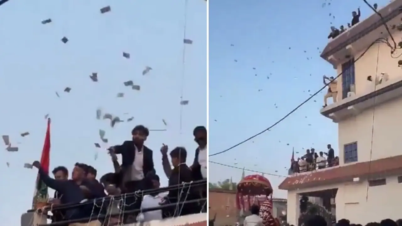 Rs 100, Rs 500 notes in air! UP family showers Rs 20 lakh cash at wedding procession; video goes viral (WATCH) Rs 100, Rs 500 notes in air! UP family showers Rs 20 lakh cash at wedding procession; video goes viral (WATCH)