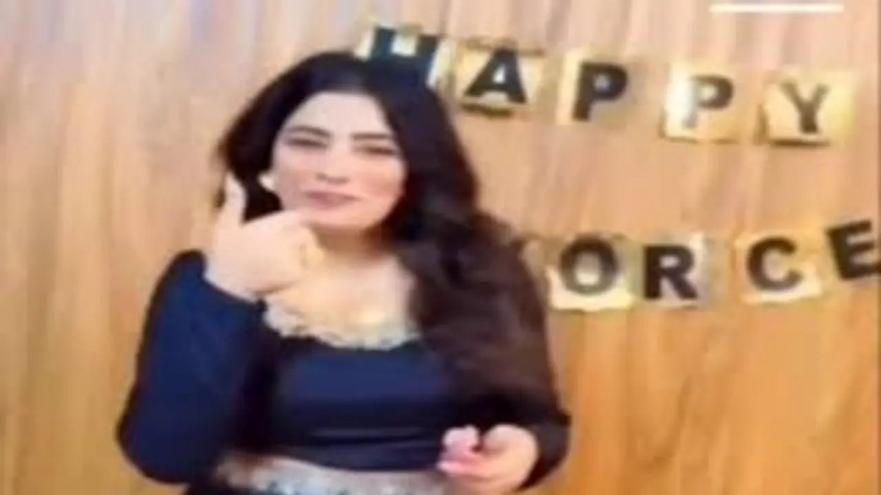 Woman throws divorce party, cuts cake, rips wedding photos, leaves Internet divided (WATCH)
