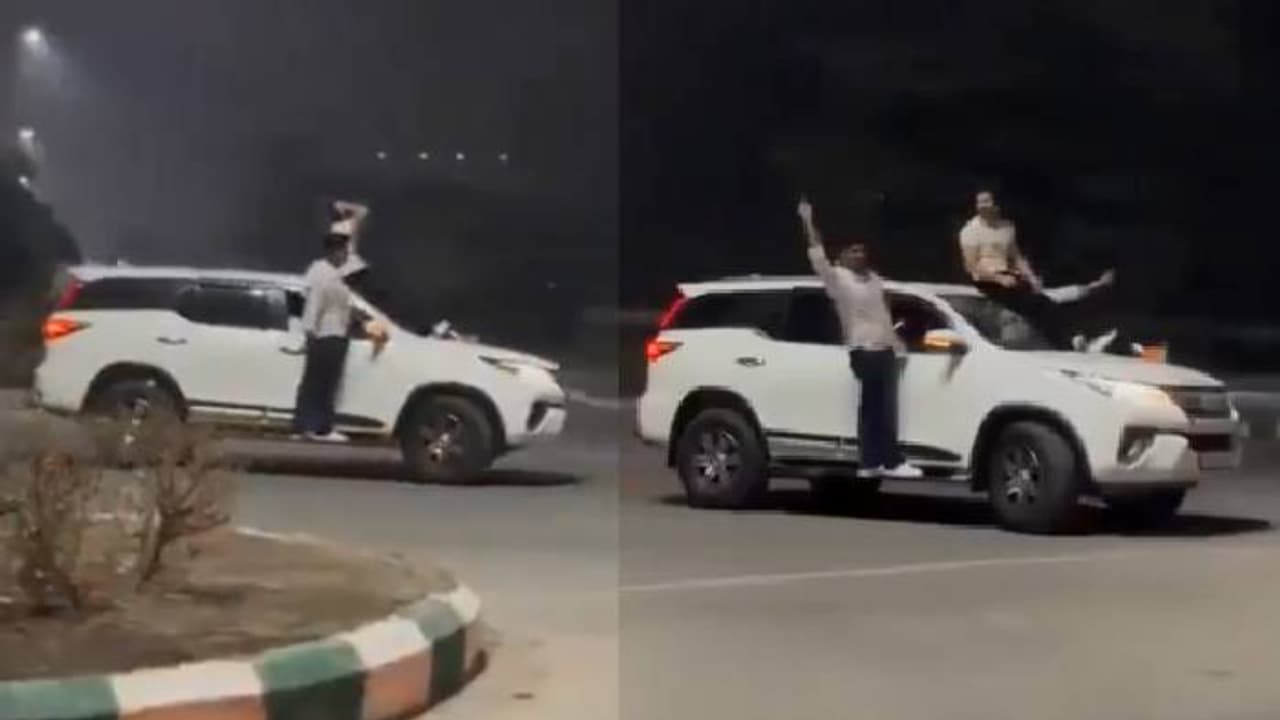 ബോണറ്റിൽ കയറിയിരുന്നു, ഡോറിൽ തൂങ്ങി, സ്ക്വിഡ് ​ഗെയിംസ് പാട്ടുംവെച്ച് നടുറോഡില്‍ ഷോ, പൊലീസ് പൊക്കി, പിഴ ഇങ്ങനെ