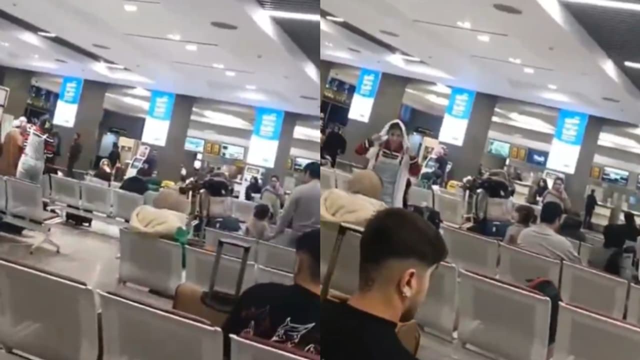 Woman removes cleric's turban at Tehran airport, use it as hijab in protest for confronting her (WATCH)