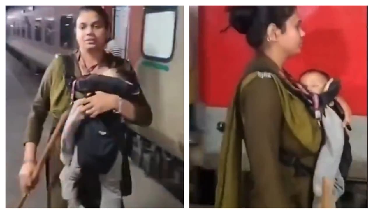 ഒരു കയ്യിൽ ലാത്തി, നെഞ്ചോട് ചേർത്ത് കൈക്കുഞ്ഞ്; 'പോരാളി'യെന്ന് സോഷ്യൽ മീഡിയ, ആർപിഎഫ് ഉദ്യോഗസ്ഥക്ക് കയ്യടി 