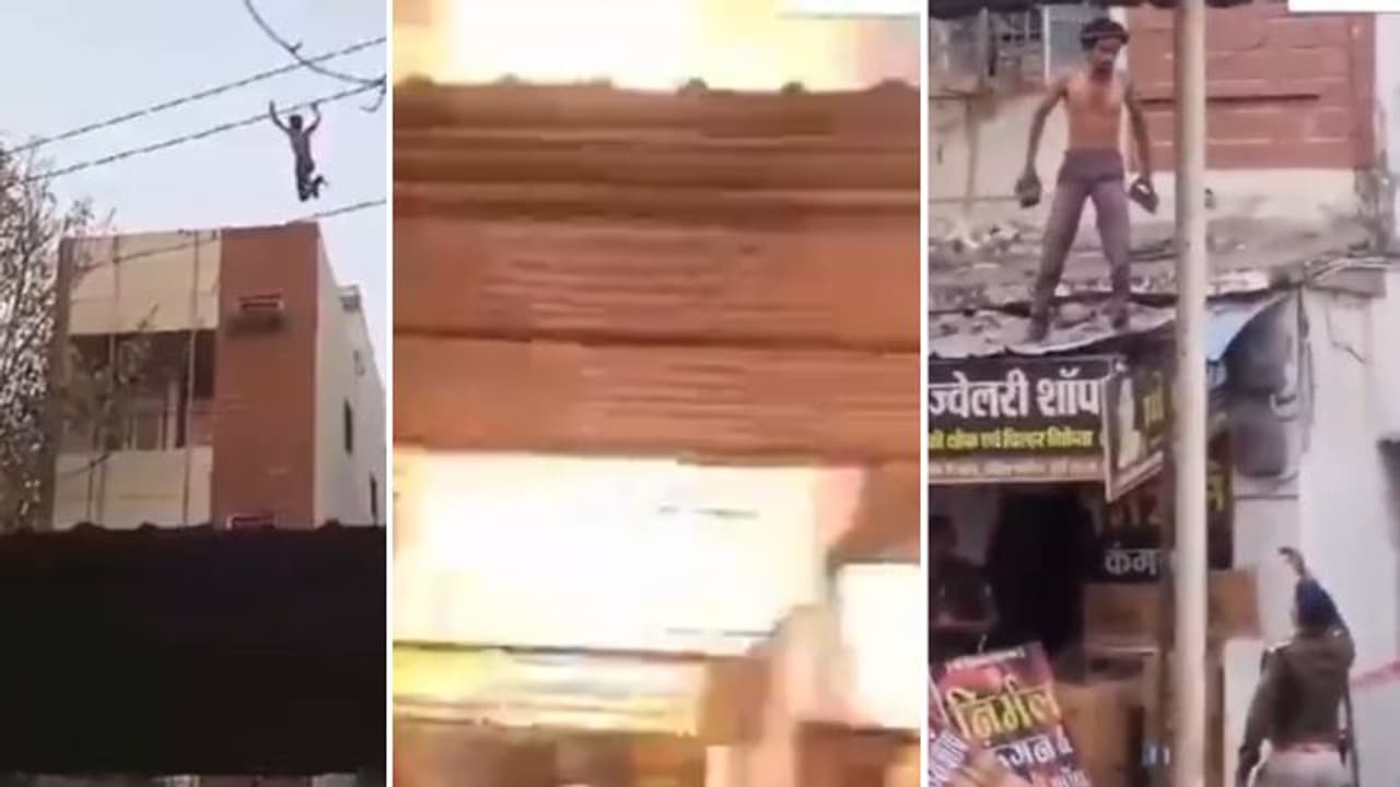 'Power of Desi Alcohol': Man jumps from 3rd floor, survives electrocution; Throws bricks at police (WATCH)