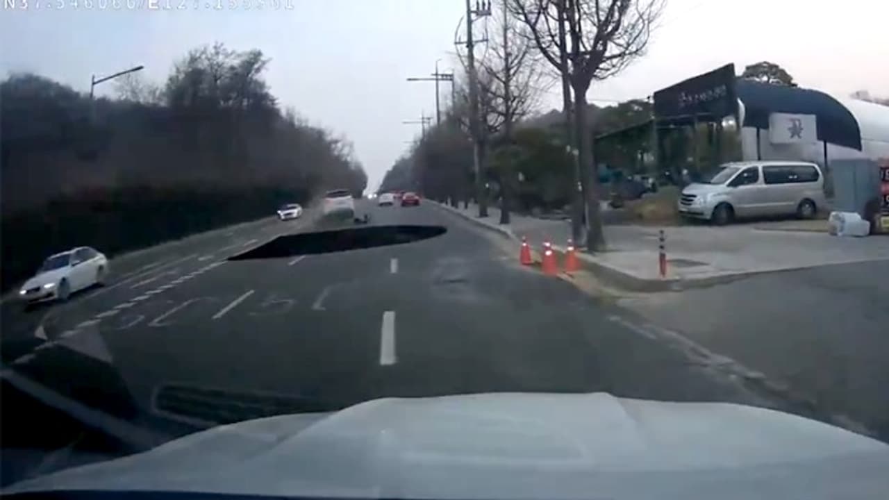 Seoul: Dashcam video captures moment motorcyclist falls in sinkhole, found dead after 17 hour search (WATCH)