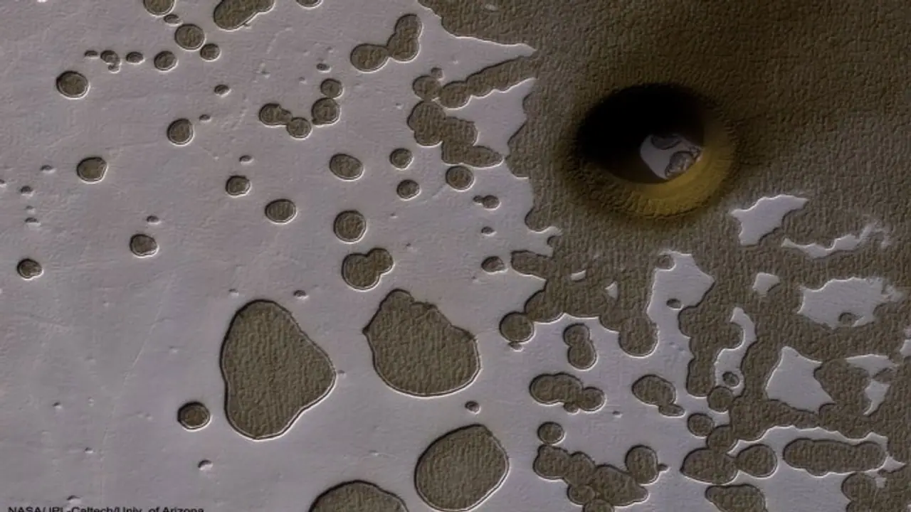 NASA spots giant 'portal' on Mars, raising hopes of life underground