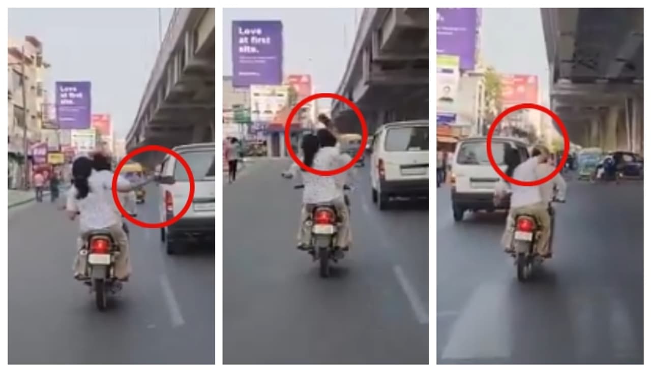 യുപിയിൽ ഓടുന്ന ബൈക്കില് വച്ച് ഭർത്താവിന്റെ മുഖത്തും തലയിലും ചെരുപ്പ് കൊണ്ട് അടിച്ച് ഭാര്യ; വീഡിയോ വൈറൽ യുപിയിൽ ഓടുന്ന ബൈക്കില് വച്ച് ഭർത്താവിന്റെ മുഖത്തും തലയിലും ചെരുപ്പ് കൊണ്ട് അടിച്ച് ഭാര്യ; വീഡിയോ വൈറൽ